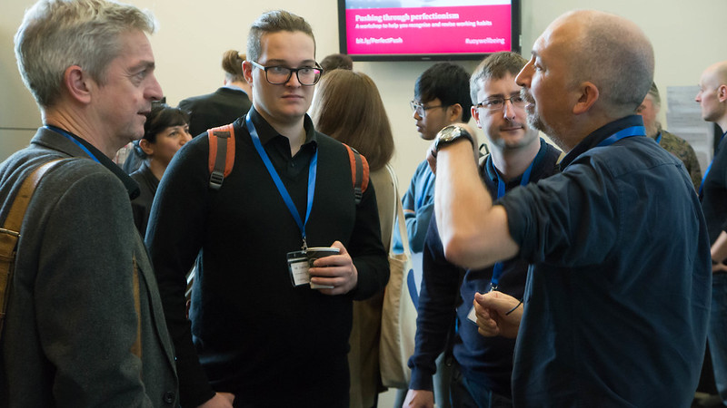 Mike Armstrong talking to attendees in a break