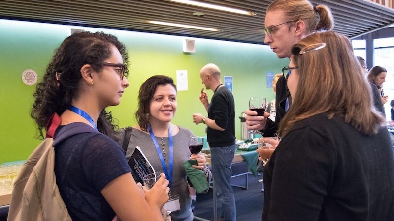 Conference attendess talking in the hallway